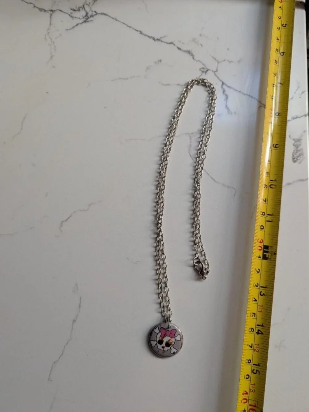 Cute Vintage Halloween Skull with Bones with a Pink Bow Pendant Necklace